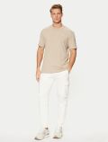 T-shirt manica corta sportiva Guess - milk - 1